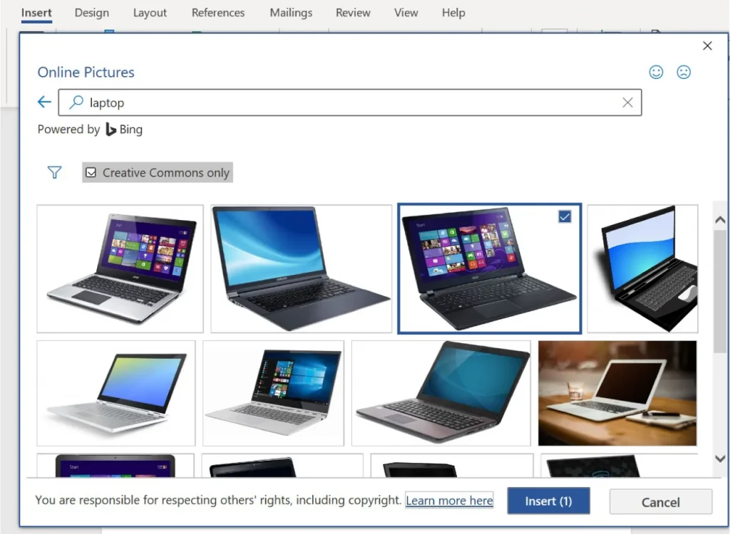 Screenshot of the 'Insert Online Pictures' window in Microsoft Word. The search term 'laptop' is entered, displaying several laptop images. One image—showing a laptop with a colorful screen—is selected, marked by a blue border and checkmark. Options include filtering by Creative Commons and buttons for 'Insert' and 'Cancel' at the bottom.