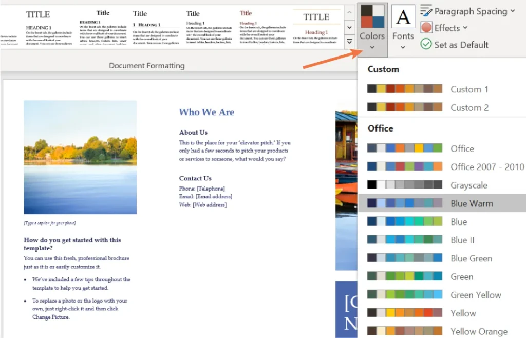 Screenshot of a Microsoft Word document with the "Design" tab open. The toolbar at the top displays various formatting styles for titles and headings. The document includes a section titled "Who We Are" with placeholder text for an elevator pitch and contact details. On the right, a dropdown menu for selecting color themes is visible, showing options like Custom 1, Office, Blue Warm, and Green Yellow. An orange arrow points to the "Colors" button in the toolbar.