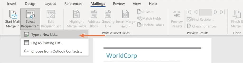 Screenshot of Microsoft Word with the "Mailings" tab selected. The "Select Recipients" dropdown menu is open, showing options: "Type a New List...", "Use an Existing List...", and "Choose from Outlook Contacts...". An orange arrow points to "Type a New List...". The toolbar displays mail merge tools including Start Mail Merge, Edit Recipient List, Insert Merge Field, Preview Results, and Finish & Merge. The document below the toolbar has a heading titled "WorldCorp".