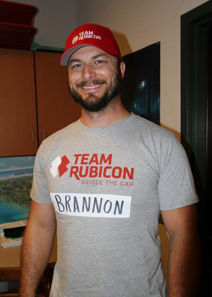 A man wearing a Team Rubicon hat and shirt.