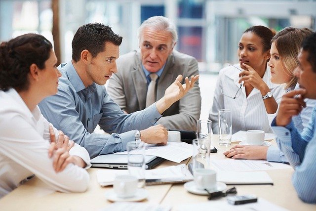 Professionals sitting around a meeting table