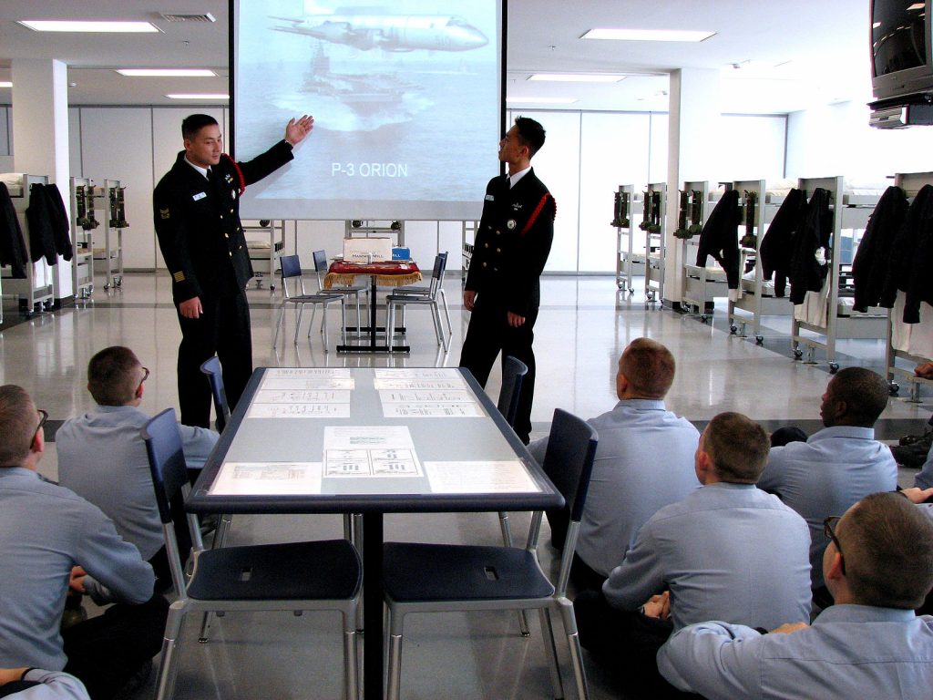 A man giving a presentation to a small group