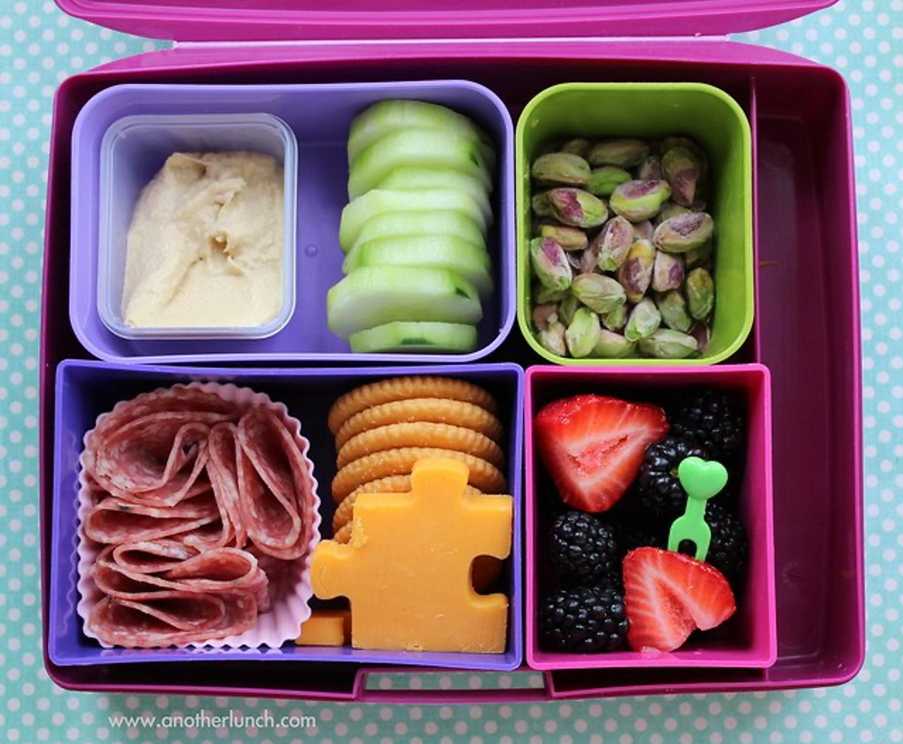 Photo of an open lunchbox showing a variety of different foods.