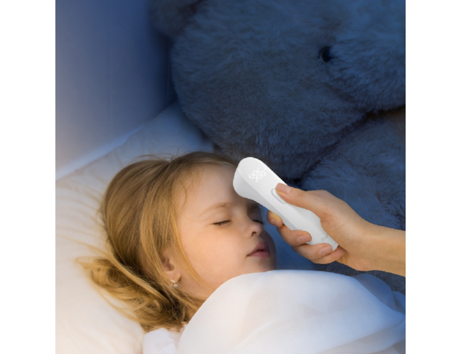 Photo showing a child's temperature being taken with a Temporal Thermometer