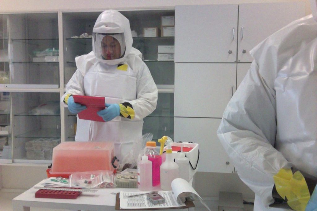 Photo of medical personnel using PAPR devise