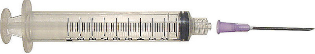 "A transparent plastic syringe with a purple needle cap and black plunger. It has measurement markings from 0 to 10 milliliters in 1 mL increments, with smaller lines for 0.2 mL. The needle is attached and partially covered by the purple cap."
