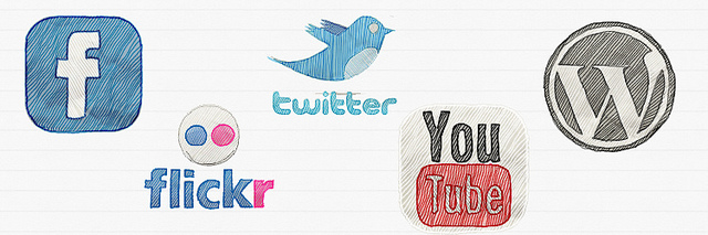 "Hand-drawn logos of five popular social media platforms on lined paper: Facebook (blue 'f' in a square), Twitter (blue bird), WordPress (circular 'W' logo), Flickr (pink and blue circles with 'flickr' below), and YouTube (red play button with 'YouTube' text)."