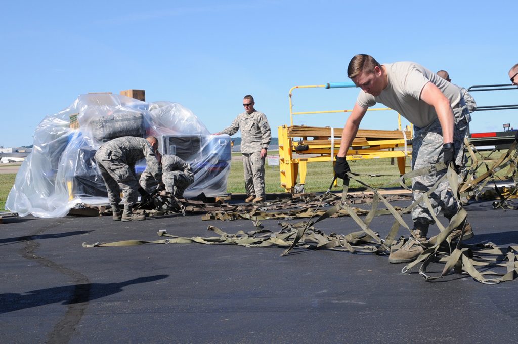 Photo of National Guard members loading supplies.