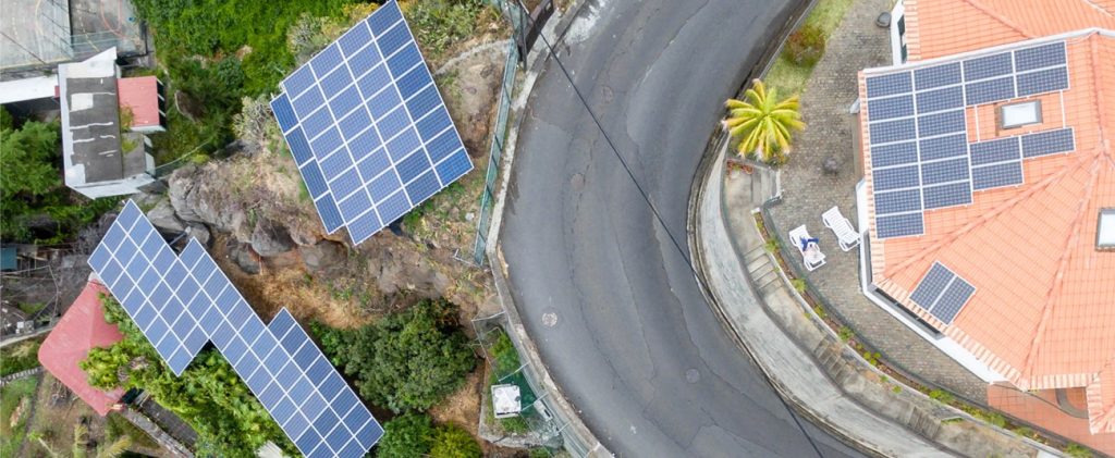 Aerial shot of a road and solar panels